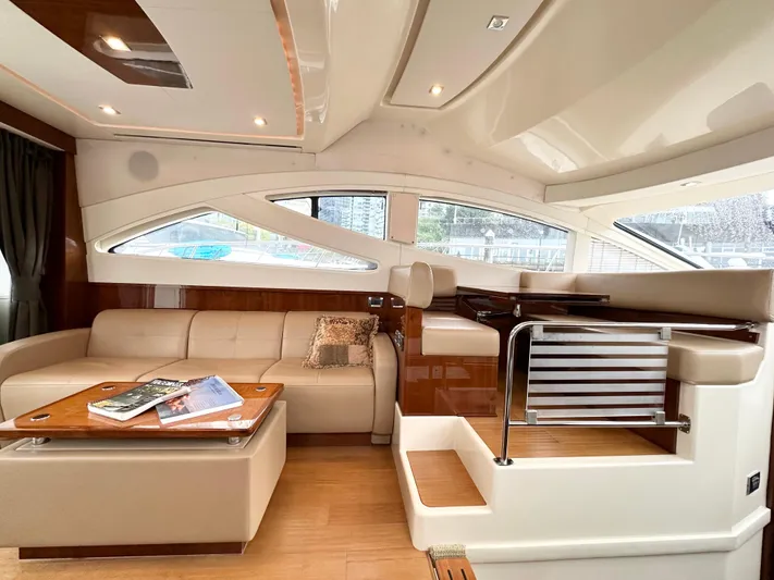  Yacht Photos Pics Luxurious interior of 2012 Sea Ray 450 Sedan Bridge yacht with modern seating and elegant design.