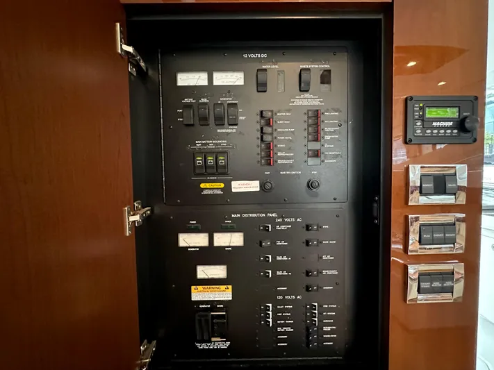  Yacht Photos Pics Electrical panel inside 2012 Sea Ray 450 Sedan Bridge yacht, featuring various switches and controls.