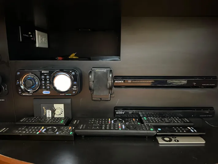  Yacht Photos Pics Entertainment system with multiple remotes on a 2012 Sea Ray 450 Sedan Bridge yacht.