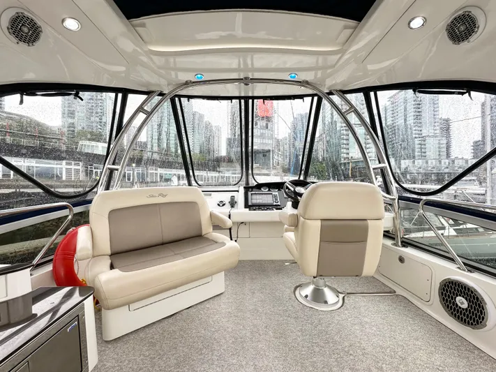  Yacht Photos Pics Interior of 2012 Sea Ray 450 Sedan Bridge yacht with modern seating and panoramic windows.