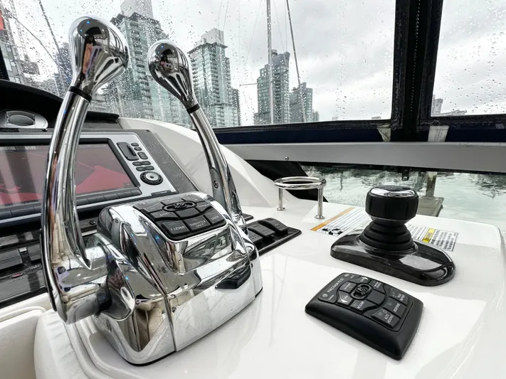  Yacht Photos Pics Control panel of 2012 Sea Ray 450 Sedan Bridge yacht with cityscape view.