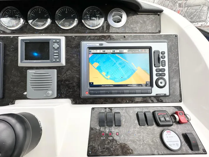  Yacht Photos Pics Dashboard of 2012 Sea Ray 450 Sedan Bridge with navigation system and controls.