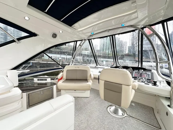  Yacht Photos Pics Interior of 2012 Sea Ray 450 Sedan Bridge yacht with luxurious seating and panoramic windows.