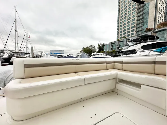  Yacht Photos Pics 2012 Sea Ray 450 Sedan Bridge yacht with beige seating at a marina.