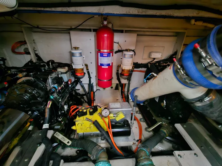  Yacht Photos Pics Engine room of a 2012 Sea Ray 450 Sedan Bridge with fire extinguisher and mechanical components.