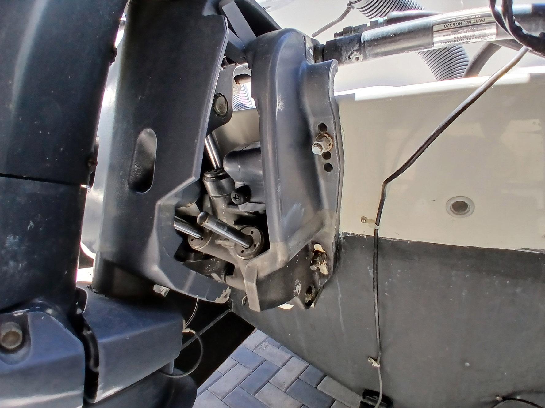 Close-up of a 2002 Protector 28 Targa boat engine component, showing mechanical details.