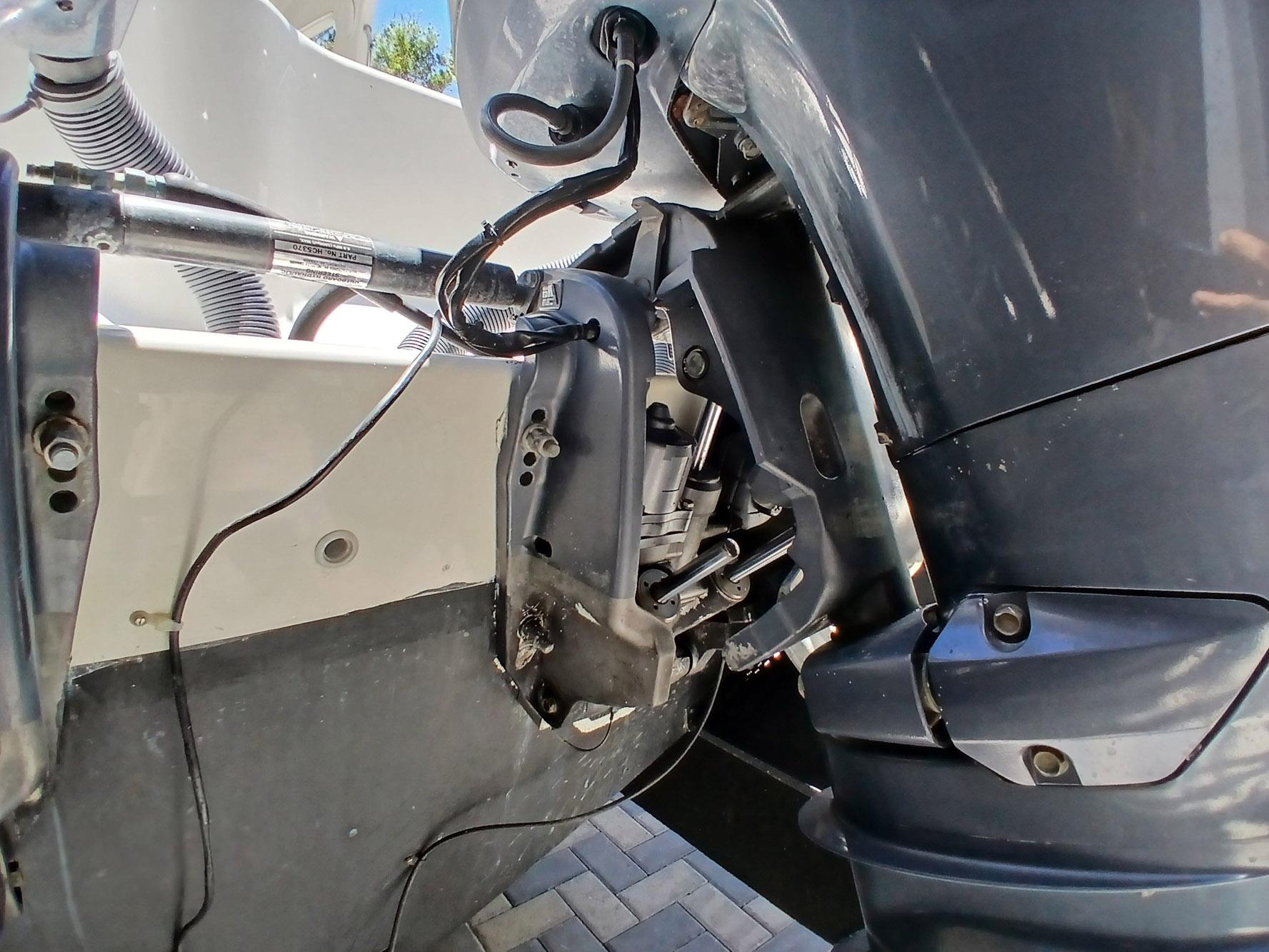 Close-up of a 2002 Protector 28 Targa boat engine and hydraulic system.