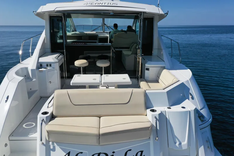  Yacht Photos Pics 2017 Cruisers Yachts 45 Cantius luxury boat with spacious seating on calm water.