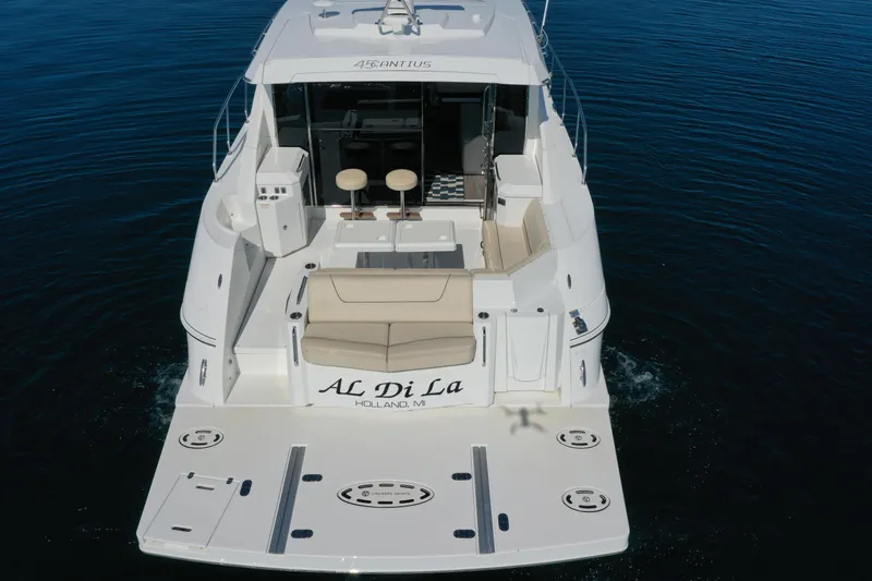  Yacht Photos Pics 2017 Cruisers Yachts 45 Cantius on water, rear view with seating and deck.
