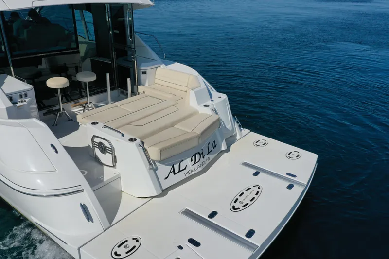  Yacht Photos Pics 2017 Cruisers Yachts 45 Cantius with spacious deck and seating on calm water.