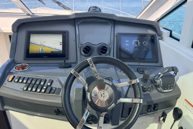  Yacht Photos Pics Helm of 2017 Cruisers Yachts 45 Cantius with dual screens and controls.