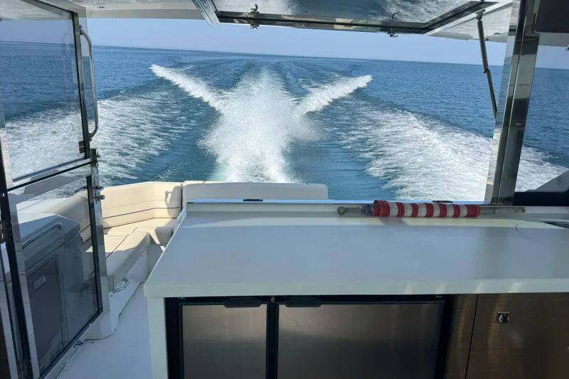  Yacht Photos Pics 2017 Cruisers Yachts 45 Cantius cruising on open water, view from the deck.