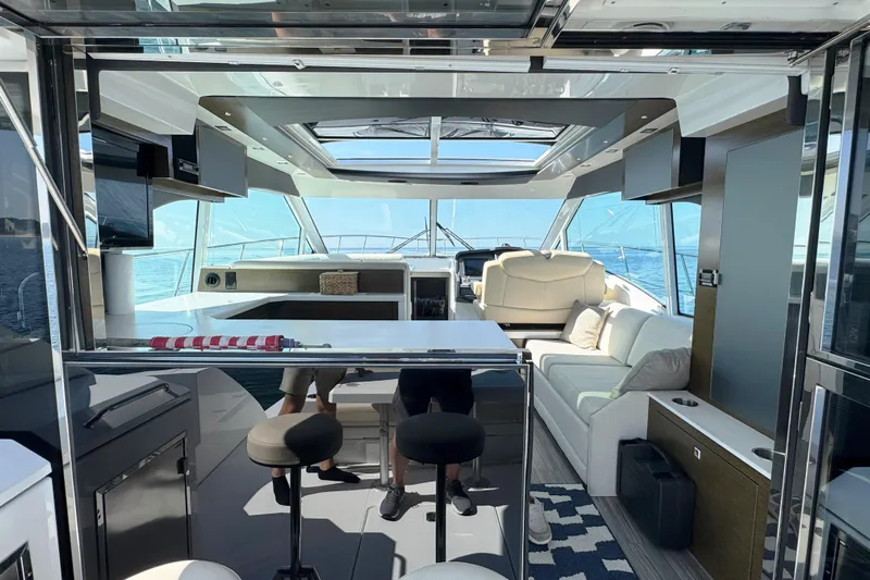  Yacht Photos Pics Luxurious interior of 2017 Cruisers Yachts 45 Cantius with modern seating and panoramic windows.