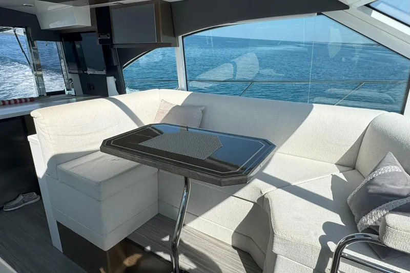  Yacht Photos Pics Luxurious interior of 2017 Cruisers Yachts 45 Cantius with ocean view and elegant seating.