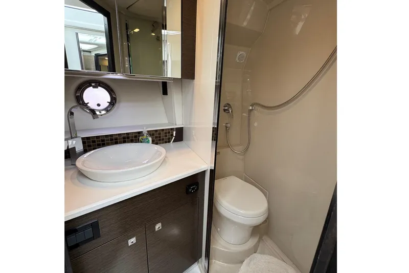  Yacht Photos Pics Luxurious bathroom in 2017 Cruisers Yachts 45 Cantius with modern fixtures and elegant design.