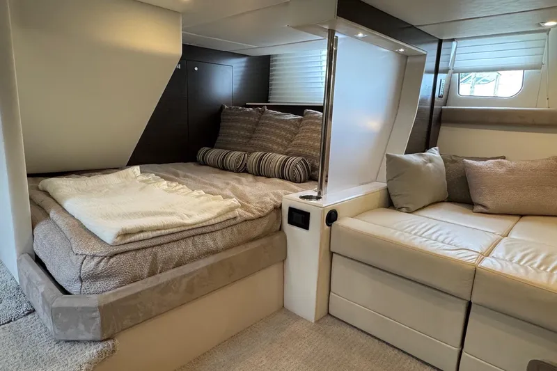  Yacht Photos Pics Luxurious interior of 2017 Cruisers Yachts 45 Cantius with cozy bed and seating area.