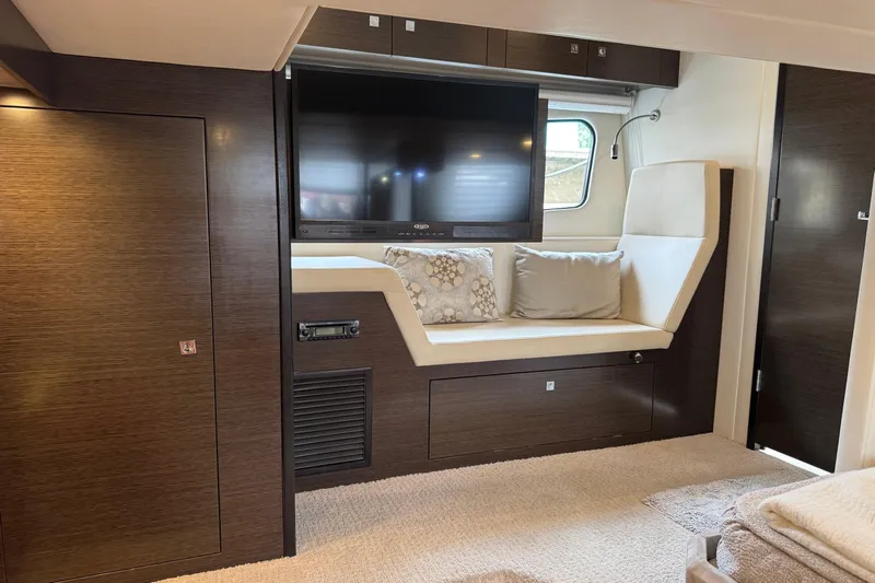  Yacht Photos Pics Luxurious interior of 2017 Cruisers Yachts 45 Cantius with TV and seating area.