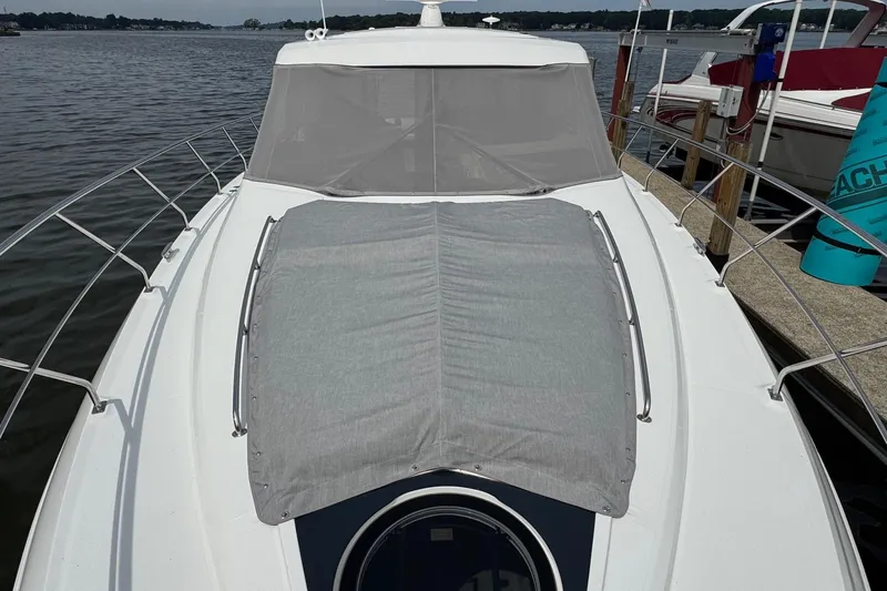  Yacht Photos Pics 2017 Cruisers Yachts 45 Cantius on water, featuring covered deck and sleek design.