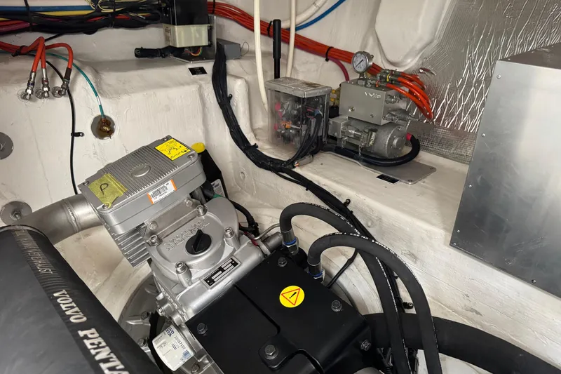  Yacht Photos Pics Engine room of 2017 Cruisers Yachts 45 Cantius, featuring Volvo Penta components and wiring.