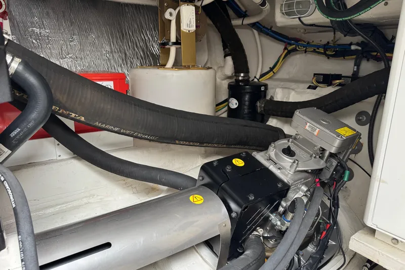  Yacht Photos Pics Engine room of 2017 Cruisers Yachts 45 Cantius with marine equipment and hoses.