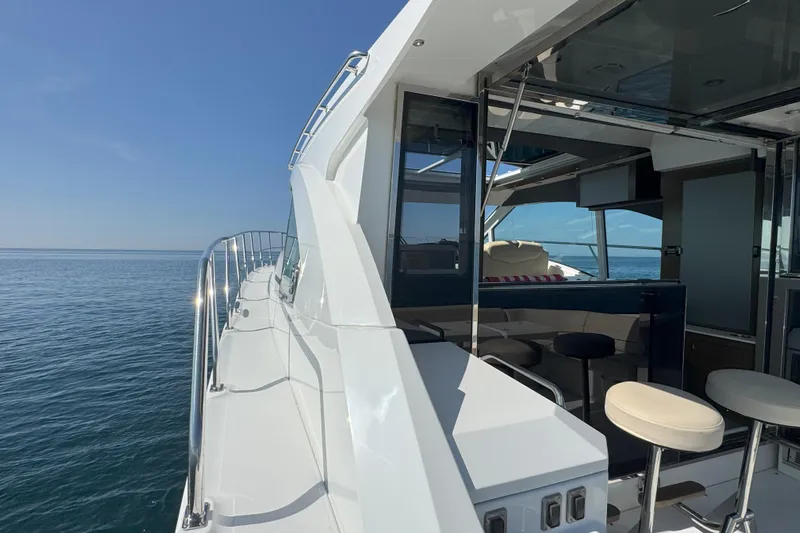  Yacht Photos Pics 2017 Cruisers Yachts 45 Cantius on calm sea, showcasing sleek design and luxurious interior.