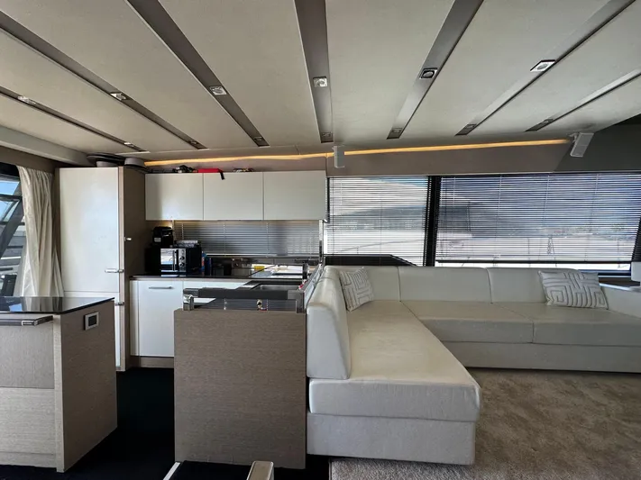  Yacht Photos Pics Luxurious interior of a 2017 Prestige 680 yacht with modern kitchen and seating area.