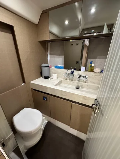  Yacht Photos Pics Bathroom interior of a 2017 Prestige 680 yacht, featuring modern fixtures and ample storage.