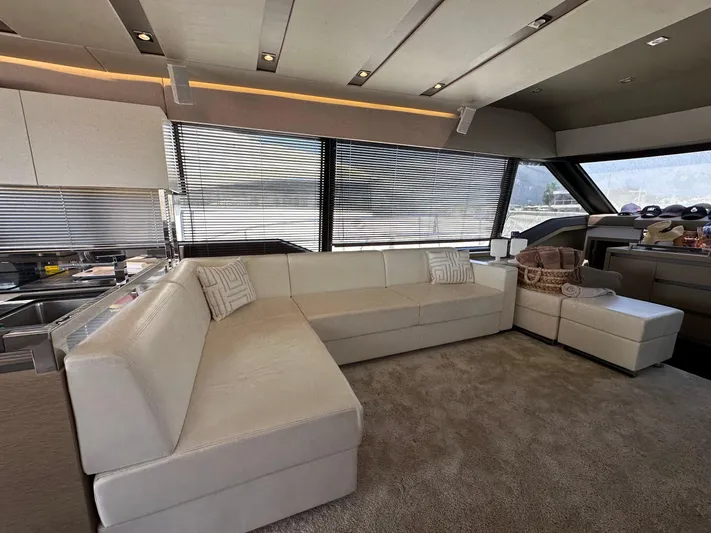  Yacht Photos Pics Luxurious interior of a 2017 Prestige 680 yacht with modern furnishings and large windows.