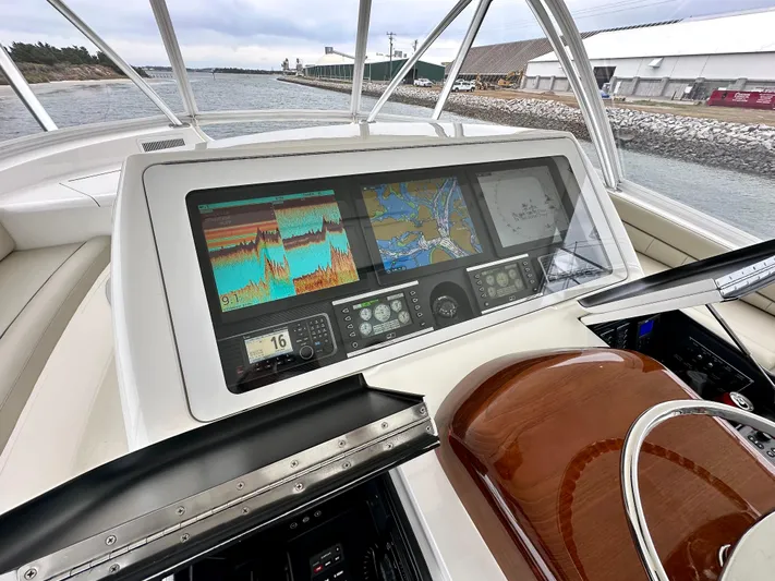 Slow Your Roll Yacht Photos Pics 2019 Viking 68 Convertible yacht dashboard with advanced navigation displays.