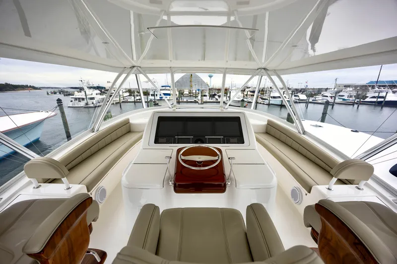 Slow Your Roll Yacht Photos Pics Luxurious 2019 Viking 68 Convertible yacht interior with marina view.
