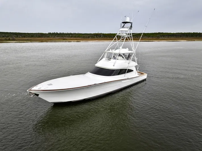 Slow Your Roll Yacht Photos Pics 2019 Viking 68 Convertible yacht cruising on calm waters.