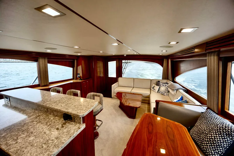 Slow Your Roll Yacht Photos Pics Luxurious interior of 2019 Viking 68 Convertible yacht with elegant seating and modern design.