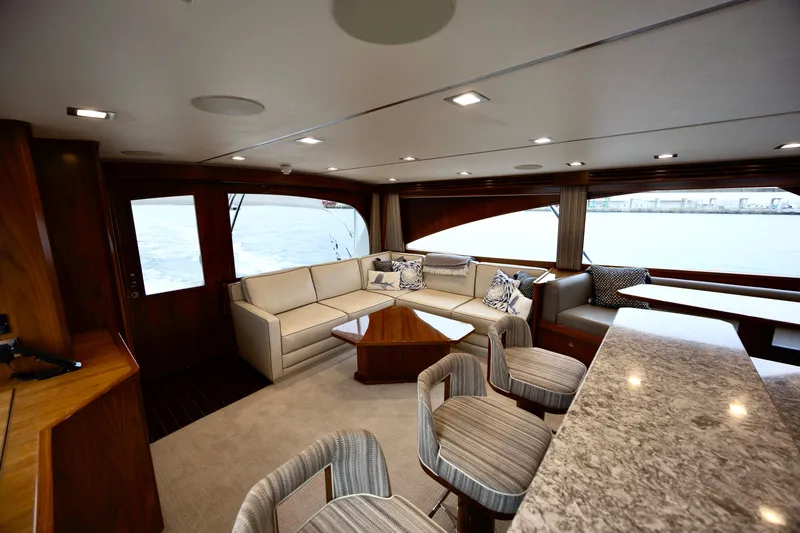 Slow Your Roll Yacht Photos Pics Luxurious interior of 2019 Viking 68 Convertible yacht with elegant seating and modern design.