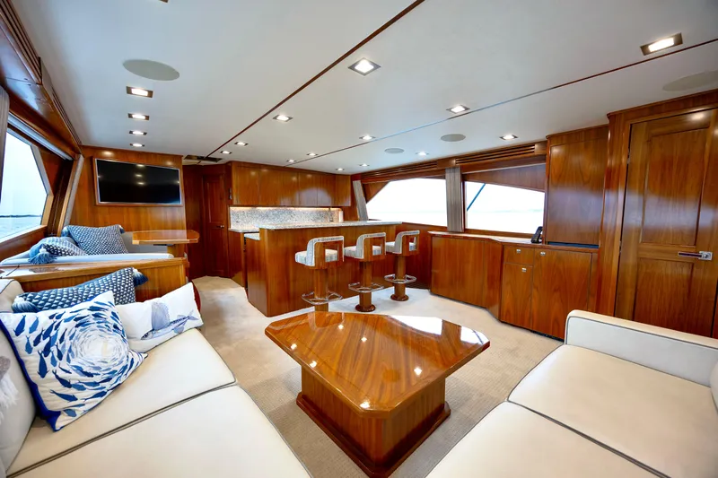 Slow Your Roll Yacht Photos Pics Luxurious interior of 2019 Viking 68 Convertible yacht with elegant wood finishes.