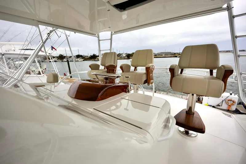 Slow Your Roll Yacht Photos Pics Luxurious 2019 Viking 68 Convertible yacht interior with elegant seating and polished wood accents.