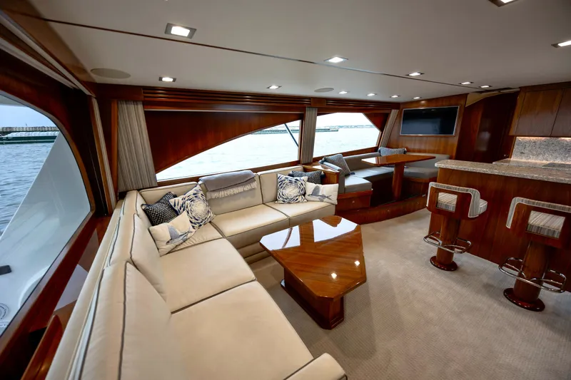 Slow Your Roll Yacht Photos Pics Luxurious interior of 2019 Viking 68 Convertible yacht with elegant seating and dining area.