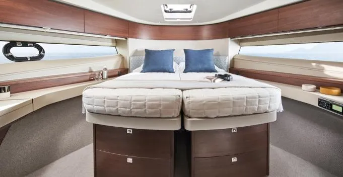  Yacht Photos Pics Luxurious 2024 Princess F50 yacht cabin with elegant bedding and modern design.