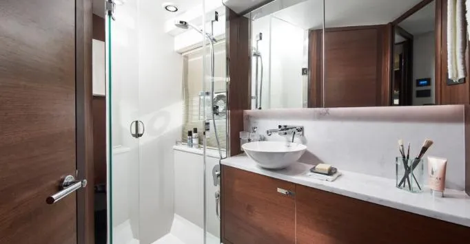  Yacht Photos Pics Luxurious bathroom interior on 2024 Princess F50 yacht, featuring modern fixtures and elegant wood finishes.