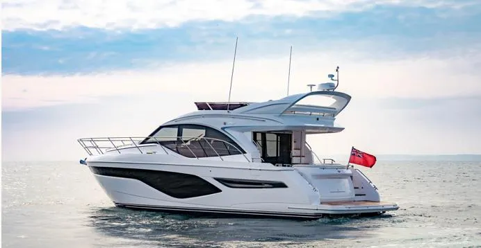  Yacht Photos Pics 2024 Princess F50 yacht cruising on open water under a clear sky.