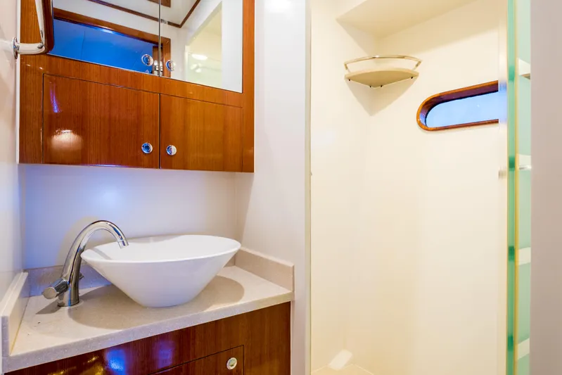  Yacht Photos Pics Luxurious bathroom in 2026 Alaska 59 Sedan yacht with modern sink and shower.
