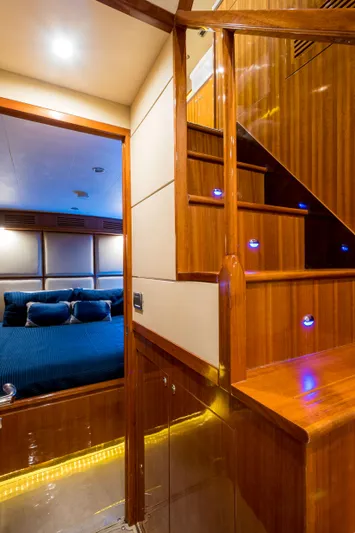  Yacht Photos Pics Luxurious interior of 2026 Alaska 59 Sedan yacht with wooden stairs and cozy bedroom.