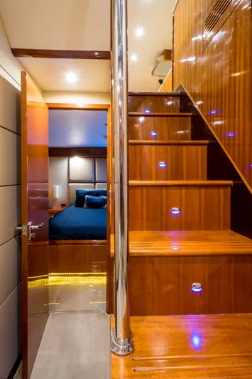  Yacht Photos Pics Luxurious interior of 2026 Alaska 59 Sedan yacht with wooden stairs and cozy bedroom.