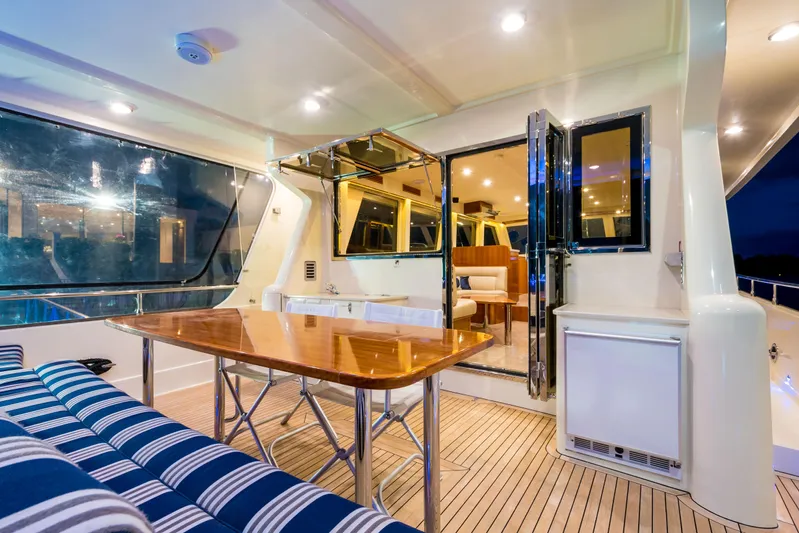  Yacht Photos Pics Luxurious interior of 2026 Alaska 59 Sedan yacht with elegant seating and dining area.