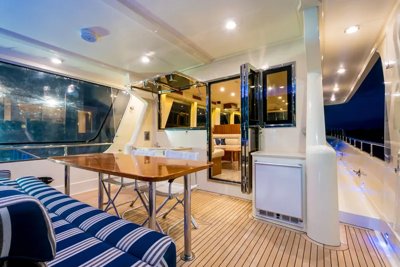  Yacht Photos Pics Luxurious 2026 Alaska 59 Sedan yacht interior with elegant seating and dining area.