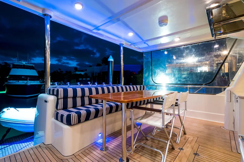  Yacht Photos Pics Luxurious 2026 Alaska 59 Sedan yacht interior with elegant seating and ambient lighting at night.
