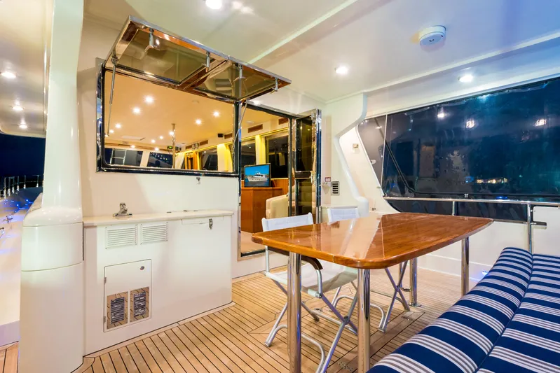  Yacht Photos Pics Luxurious interior of 2026 Alaska 59 Sedan yacht with dining area and modern amenities.