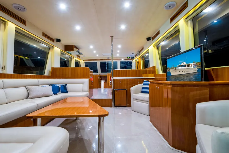  Yacht Photos Pics Luxurious interior of 2026 Alaska 59 Sedan yacht with modern furnishings and large windows.