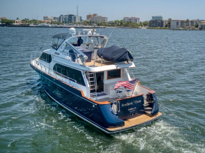 The Cotton Picker Yacht Photos Pics Ocean Alexander 610 Pilothouse yacht cruising in Tampa waters, 2000 model, with American flag.