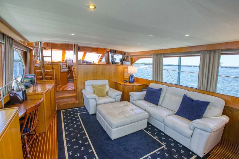 The Cotton Picker Yacht Photos Pics Luxurious interior of 2000 Ocean Alexander 610 Pilothouse yacht with elegant seating and ocean views.