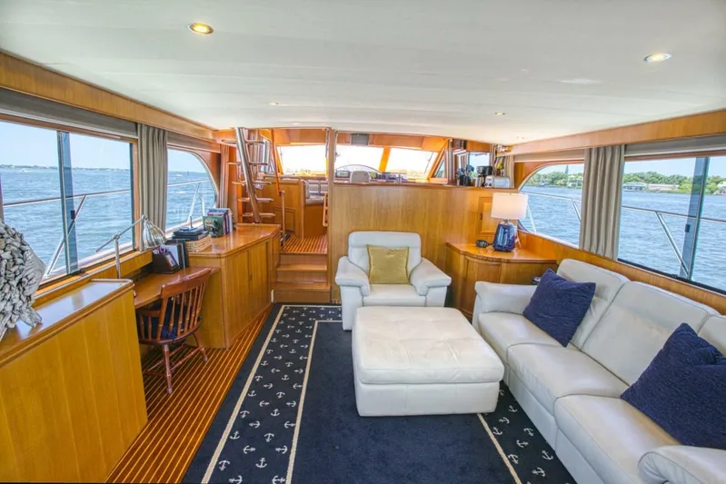 The Cotton Picker Yacht Photos Pics Luxurious interior of 2000 Ocean Alexander 610 Pilothouse yacht with elegant seating and ocean views.